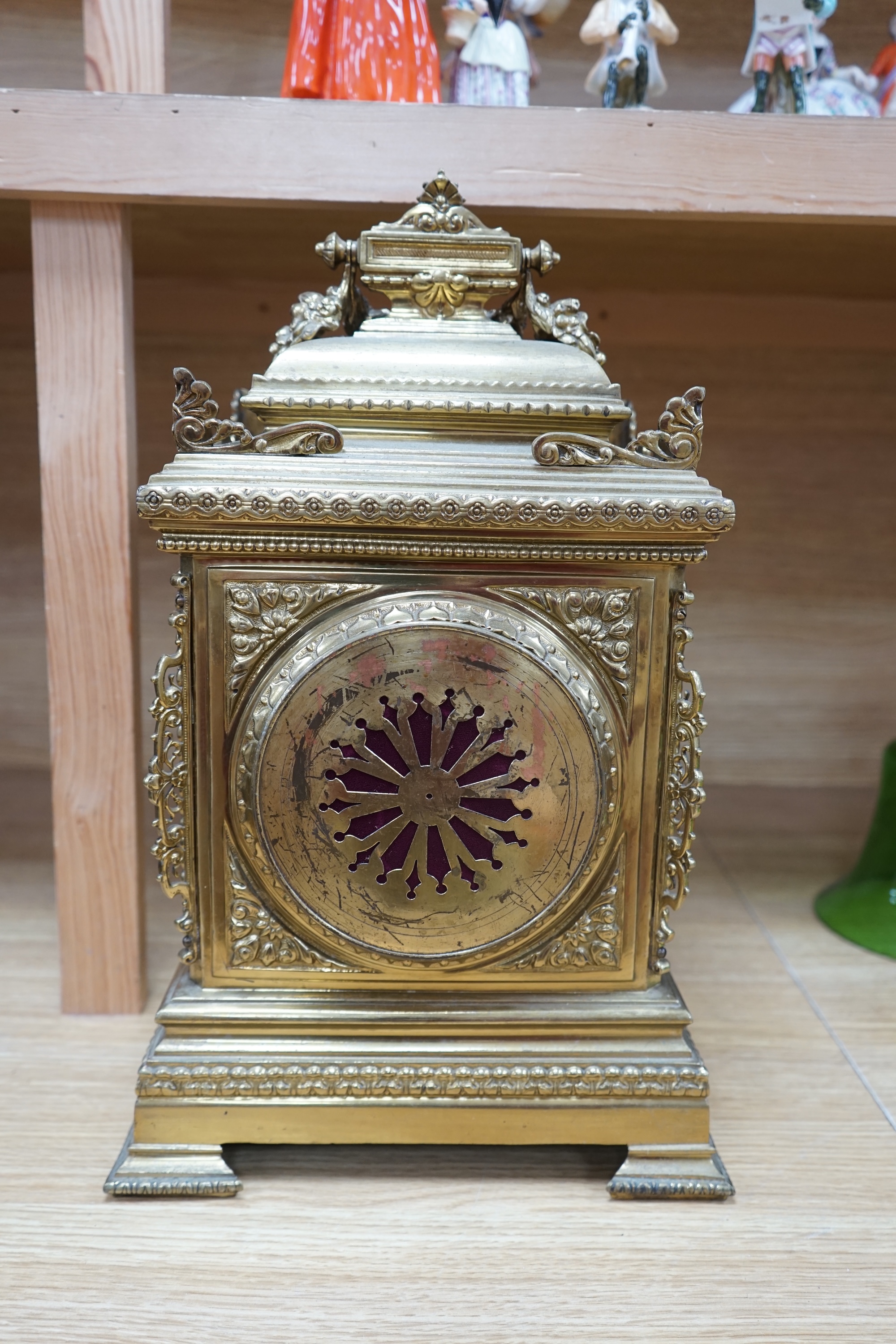 A Louis XVI style ormolu mantel clock with enamel dial, key and pendulum, 42cm. Condition - fair to good